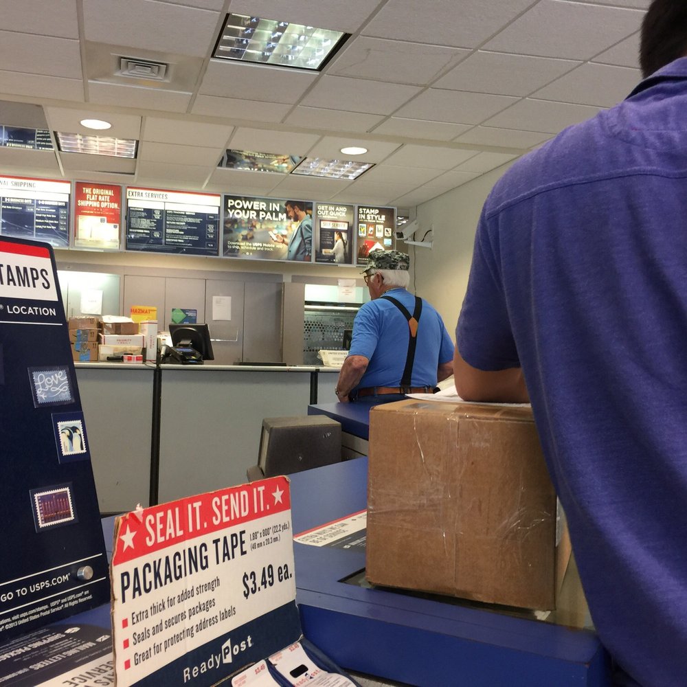 One person working and 9 people in line. Workers walk past her not offering to help. What in the world!