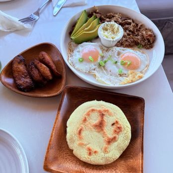 Encuentro Cafe - Breakfast plate w arepa, pork, sunny side up eggs, avocado, and plaintain - Venezuelan Near Me - San Diego, California Encuentro Cafe - Breakfast plate w arepa, pork, sunny side up eggs, avocado, and plaintain - Venezuelan Near Me - San Diego, California
