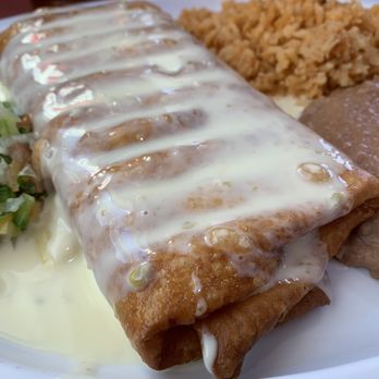 Buen Provecho - Chicken Tinga chimichanga. Crispy and flavorful. - Mexican Near Me - Parchment, Michigan Buen Provecho - Chicken Tinga chimichanga. Crispy and flavorful. - Mexican Near Me - Parchment, Michigan