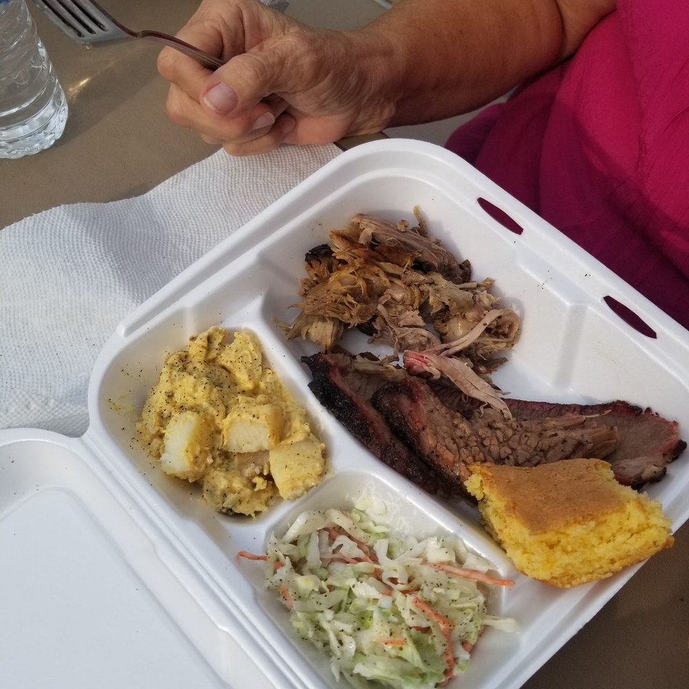 FLX BBQ - a woman eating a meal - Barbeque Near Me - Canandaigua, New York