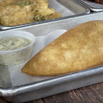 Sofrito Latin Cafe - Cheese empanada! Delicious and crunchy - Latin American Near Me - Orlando, Florida Sofrito Latin Cafe - Cheese empanada! Delicious and crunchy - Latin American Near Me - Orlando, Florida