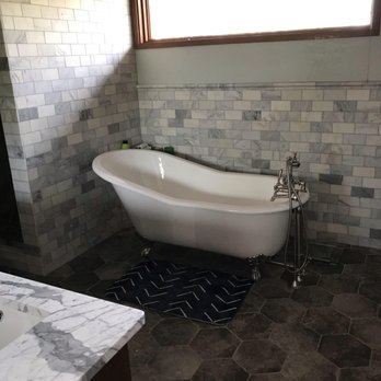 A World of Tile - a bathtub in a bathroom - Flooring Near Me - Albuquerque, New Mexico