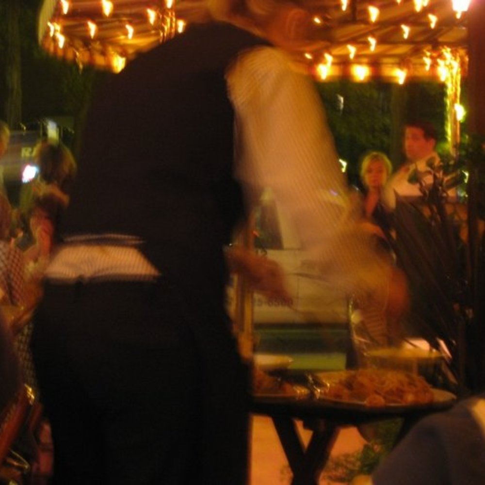 Carmine's - Waiter mixing our dishes for us - Italian Near Me - Chicago, Illinois