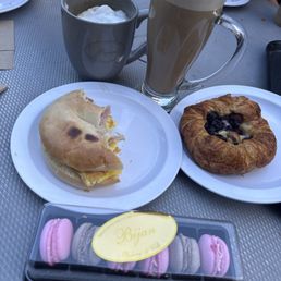 Breakfast sandwich, Blueberry danish, macarons and Soy Caramel Late. Breakfast sandwich, Blueberry danish, macarons and Soy Caramel Late.