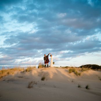 Lori Douglas Photography - Beautiful wedding portraits on the dunes at Jockey's Ridge State Park in Nags Head, NC by LORI DOUGLAS Photography - Event Photography Near Me - Kitty Hawk, North Carolina Lori Douglas Photography - Beautiful wedding portraits on the dunes at Jockey's Ridge State Park in Nags Head, NC by LORI DOUGLAS Photography - Event Photography Near Me - Kitty Hawk, North Carolina