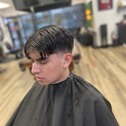 The Clipper Head Barber - Number 2 up mid fade with a low taper