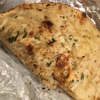 Mango Indian Cuisine - Look how big and delicious that garlic naan is! - Indian Near Me - Bellmore, New York Mango Indian Cuisine - Look how big and delicious that garlic naan is! - Indian Near Me - Bellmore, New York