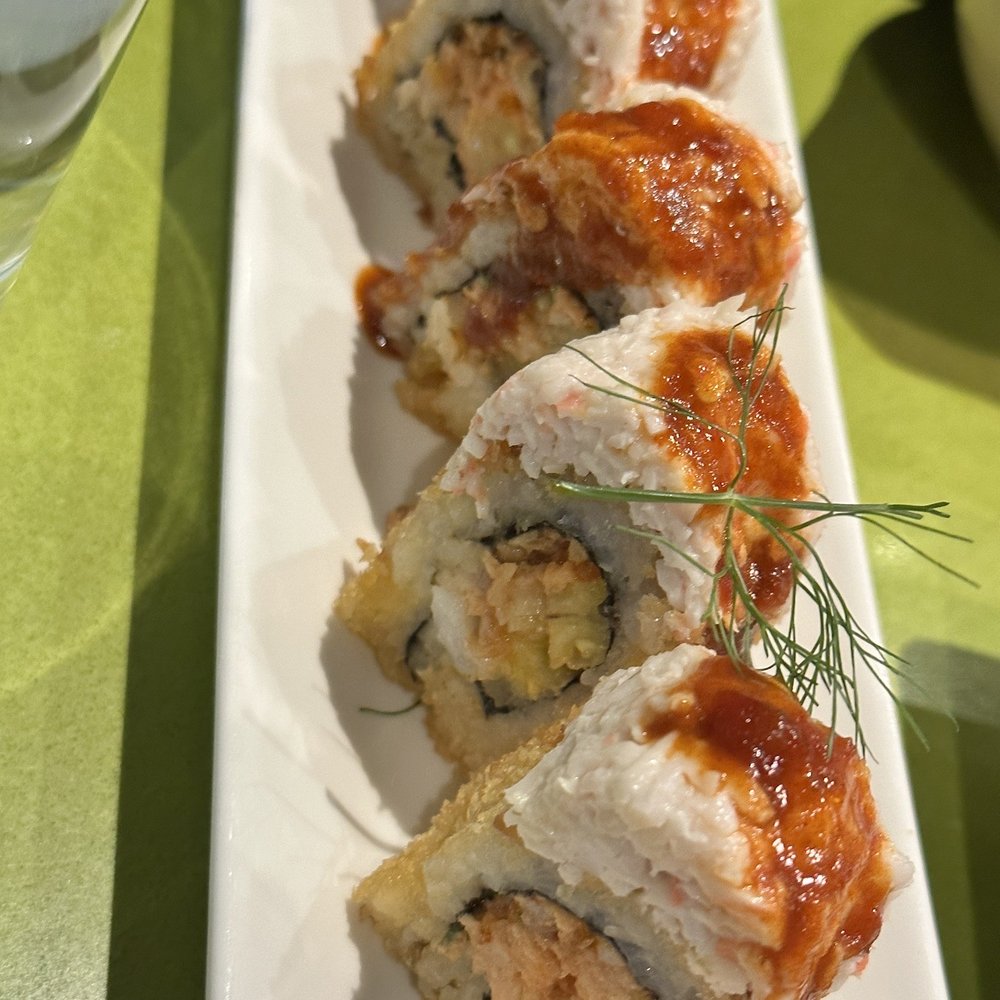 Tona - Coconut Crunch yellowtail, fresh pineapple, panko fried w/coconut crust, topped w/snow crab salad and chili garlic sauce - Sushi Bars Near Me - Ogden, Utah Tona - Coconut Crunch yellowtail, fresh pineapple, panko fried w/coconut crust, topped w/snow crab salad and chili garlic sauce - Sushi Bars Near Me - Ogden, Utah