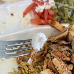 Chicken Shawarma, seasoned basmati rice and the garlic sauce...the garlic sauce is MAGIC!!!! Also tomatoes and pickle relish. Chicken Shawarma, seasoned basmati rice and the garlic sauce...the garlic sauce is MAGIC!!!! Also tomatoes and pickle relish.