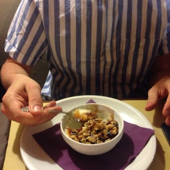 Passaparola - It looks like breakfast but actually it's dessert or "dolce". Panna cotta con caramello e noca. - Italian Near Me - Forlì, FC