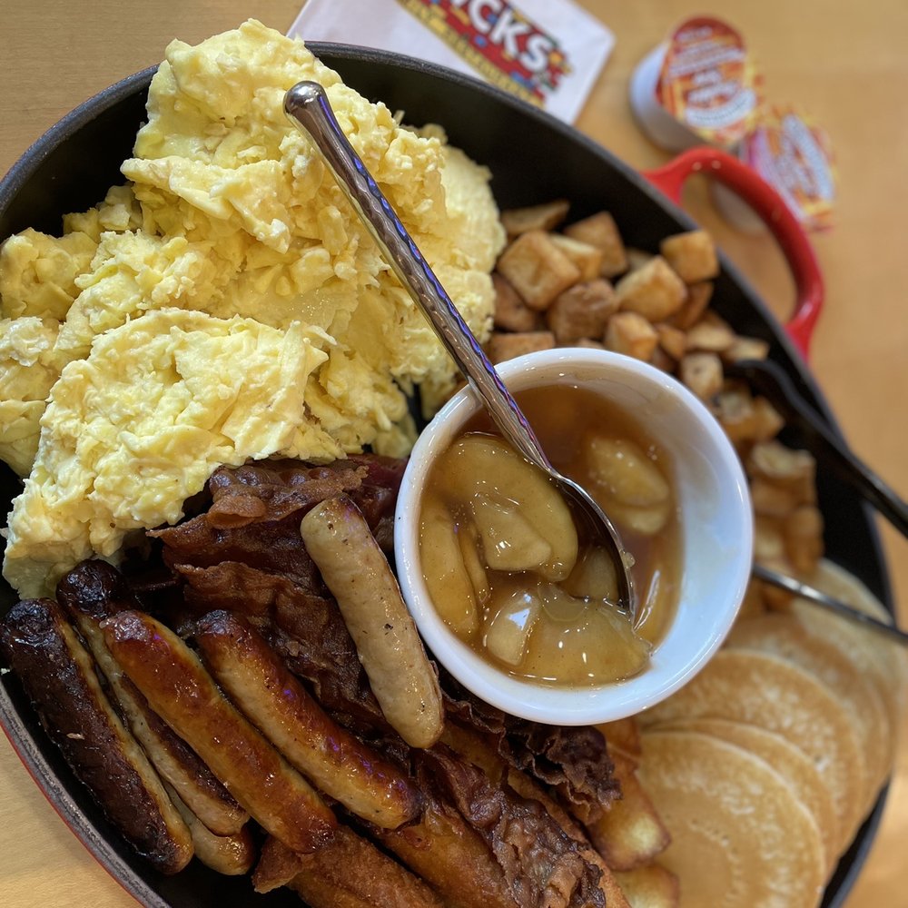 Bacon, eggs, sausage, pancakes, potatoes with caramel apples. Bacon, eggs, sausage, pancakes, potatoes with caramel apples.
