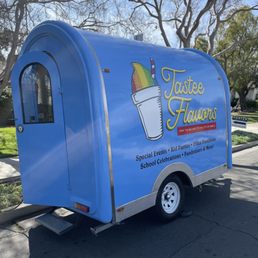 an ice cream truck parked on the side of the road