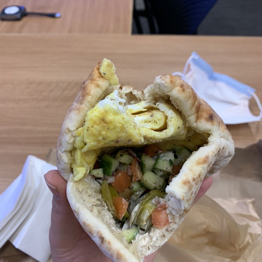 Claire's Kitchen Cafe - Upper East Side - Egg in a pita- Israeli salad perfectly cooked eggs tahini and pickles - Coffee & Tea Near Me - New York, New York Claire's Kitchen Cafe - Upper East Side - Egg in a pita- Israeli salad perfectly cooked eggs tahini and pickles - Coffee & Tea Near Me - New York, New York