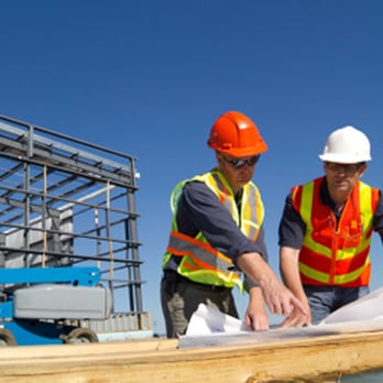 Cnh Construction - two men working on a building - General Contractors Near Me Cnh Construction - two men working on a building - General Contractors Near Me