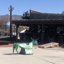 Cool patio with cornhole, lots of seating, some covered some not but a good watering hole!