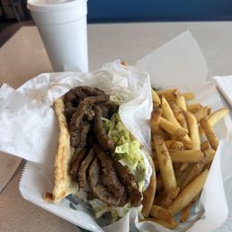 Delicious gyro and fries. Delicious gyro and fries.