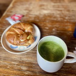 Vinaka Cafe - Egg and cheese croissant sandwich with matcha latte