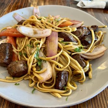 Picante - Tallarin saltado de carne Stir-fried Beef sirloin noodles - Peruvian Near Me - Ontario, California Picante - Tallarin saltado de carne Stir-fried Beef sirloin noodles - Peruvian Near Me - Ontario, California