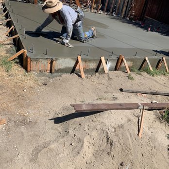 ICE General Builder - a man working on a concrete slab - General Contractors Near Me - San Fernando, California