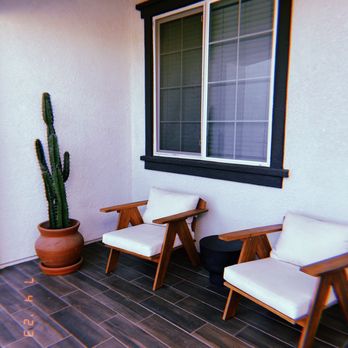 Helios Vacation Rentals - front patio lounge area - Property Management Near Me Helios Vacation Rentals - front patio lounge area - Property Management Near Me
