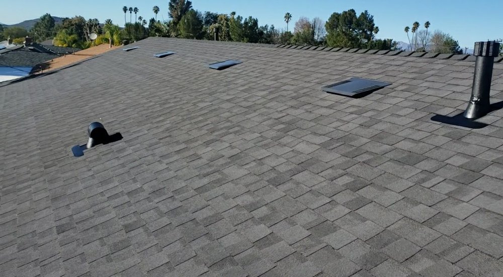 Slide of AE Roofing Experts