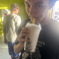 Drinking a chocolate protein shake, super yummy