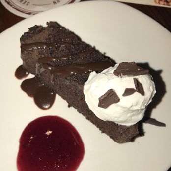 Outback Steakhouse - Sample of this rich, thick chocolate cake with whipped cream & raspberry sauce on the side.. the chocolate shavings on top were a great add! - Steakhouses Near Me - Virginia Beach, Virginia Outback Steakhouse - Sample of this rich, thick chocolate cake with whipped cream & raspberry sauce on the side.. the chocolate shavings on top were a great add! - Steakhouses Near Me - Virginia Beach, Virginia