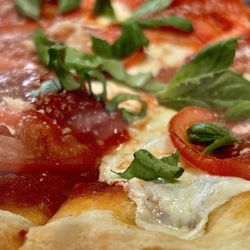 Margarita pizza with basil on top