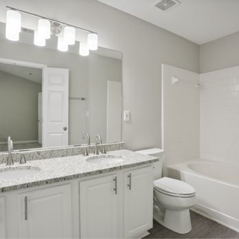 Curbio - a bathroom with a tub, sink, and toilet - General Contractors Near Me - Potomac, Maryland Curbio - a bathroom with a tub, sink, and toilet - General Contractors Near Me - Potomac, Maryland