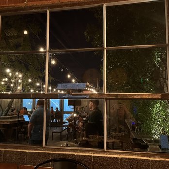 Helix Brewing - Watching the band play in the courtyard while sitting inside - Breweries Near Me - La Mesa, California Helix Brewing - Watching the band play in the courtyard while sitting inside - Breweries Near Me - La Mesa, California