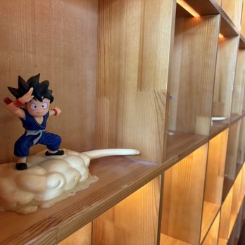 Muteki Ramen & Izakaya - One of the figurines; WuKong with the flying nimbus. - Ramen Near Me - Gresham, Oregon Muteki Ramen & Izakaya - One of the figurines; WuKong with the flying nimbus. - Ramen Near Me - Gresham, Oregon