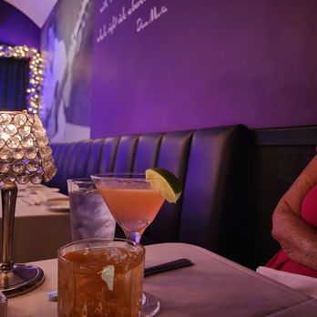 Purple Room - Black Tie Affair" (Black Manhattin) and "Bacall" (Cosmo), each $19 and delicious! - New American Near Me - Palm Springs, California Purple Room - Black Tie Affair" (Black Manhattin) and "Bacall" (Cosmo), each $19 and delicious! - New American Near Me - Palm Springs, California