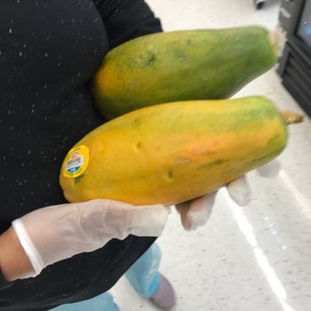 Giant - a woman holding two ripe mangoes - Grocery Near Me - Potomac Falls, Virginia