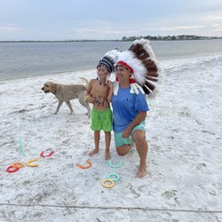 Littleheads Kayak Rentals - Indian kid at dog island getting his feathers