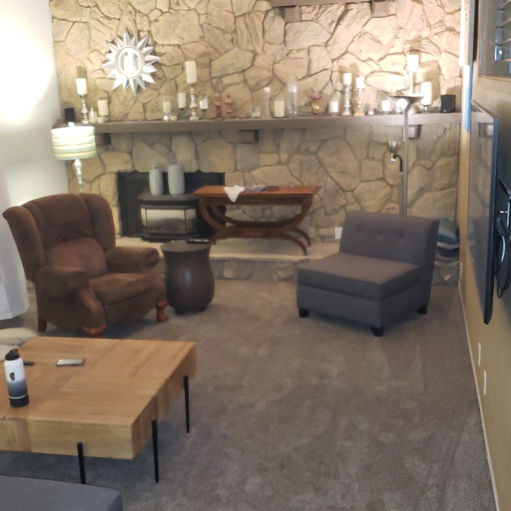a living room with a stone wall a living room with a stone wall