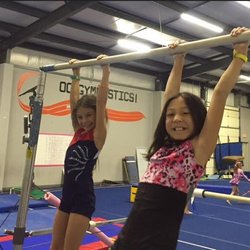OC Gymnastics - Campers enjoying time on the bars