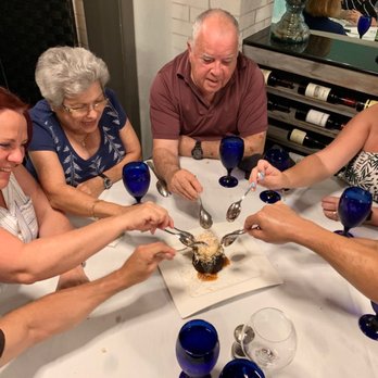 Verdi's American Bistro - Family eating the cake! - New American Near Me - Marco Island, Florida Verdi's American Bistro - Family eating the cake! - New American Near Me - Marco Island, Florida