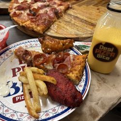 Masala fries, Tandoori Chicken Wing, meat pizza, buffalo chicken wings, and mango lassi.