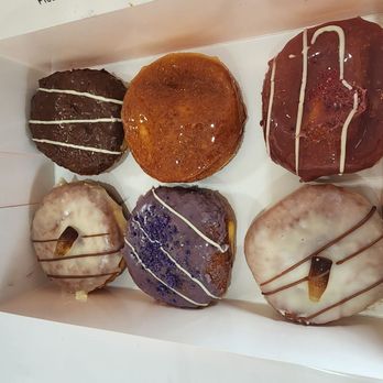 Fuzion Donuts - Top right: Ferrero Rocher, creme brulee, lychee raspberry Bottom row: 2 root beers and an ube - Donuts Near Me - Edmonton, Alberta Fuzion Donuts - Top right: Ferrero Rocher, creme brulee, lychee raspberry Bottom row: 2 root beers and an ube - Donuts Near Me - Edmonton, Alberta