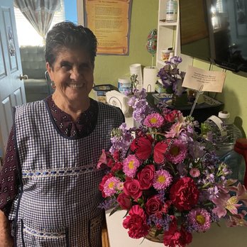 Serrano Flowers - This my grandma with her flowers. Look at her smile. She was so happy. - Florists Near Me - Riverside, California Serrano Flowers - This my grandma with her flowers. Look at her smile. She was so happy. - Florists Near Me - Riverside, California