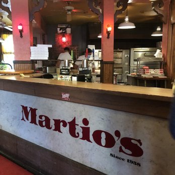 Martio's Pizza - a restaurant counter with a sign on it - Pizza Near Me - Nanuet, New York