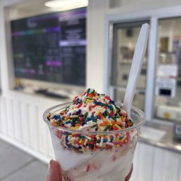 Vanilla soft serve with rainbow sprinkles Vanilla soft serve with rainbow sprinkles