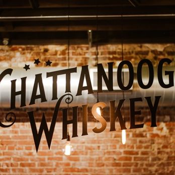 Chattanooga Whiskey - a brick wall with a sign that says chattanooga whiskey - Distilleries Near Me - Chattanooga, Tennessee