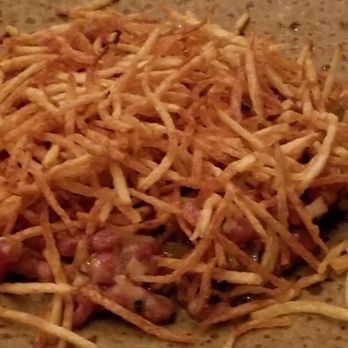 Husk - Beef tartar under shoe string potatoes. - Southern Near Me - Nashville, Tennessee Husk - Beef tartar under shoe string potatoes. - Southern Near Me - Nashville, Tennessee