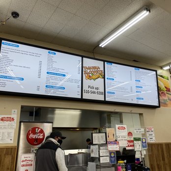 Taqueria El Cohete - Front counter - Burgers Near Me - Oakland, California