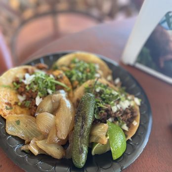 Tacos El Pariente - a plate of food on a table - Food Trucks Near Me - Charleston, South Carolina Tacos El Pariente - a plate of food on a table - Food Trucks Near Me - Charleston, South Carolina