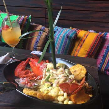 CVI.CHE 105 - ceviche special with lobster, shrimp and fish with oysters on the side plus a passion fruit sangria - Peruvian Near Me - Miami, Florida