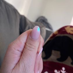 Smile Nails & Spa - Not rounded, and completely different than the opposite thumb (longer and more oval)
