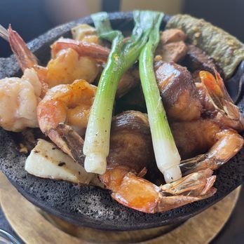 El Sinaloense Mariscos and Grill - Mar y tierra molcajete. Base is green chile sauce which is SPICY. - Mexican Near Me - Albuquerque, New Mexico El Sinaloense Mariscos and Grill - Mar y tierra molcajete. Base is green chile sauce which is SPICY. - Mexican Near Me - Albuquerque, New Mexico