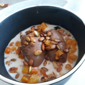 The Table at Crate - Chocolate pudding with apricot, granola and macadamia milk.  Interestingly delicious and rich! - New American Near Me - Oak Brook, Illinois